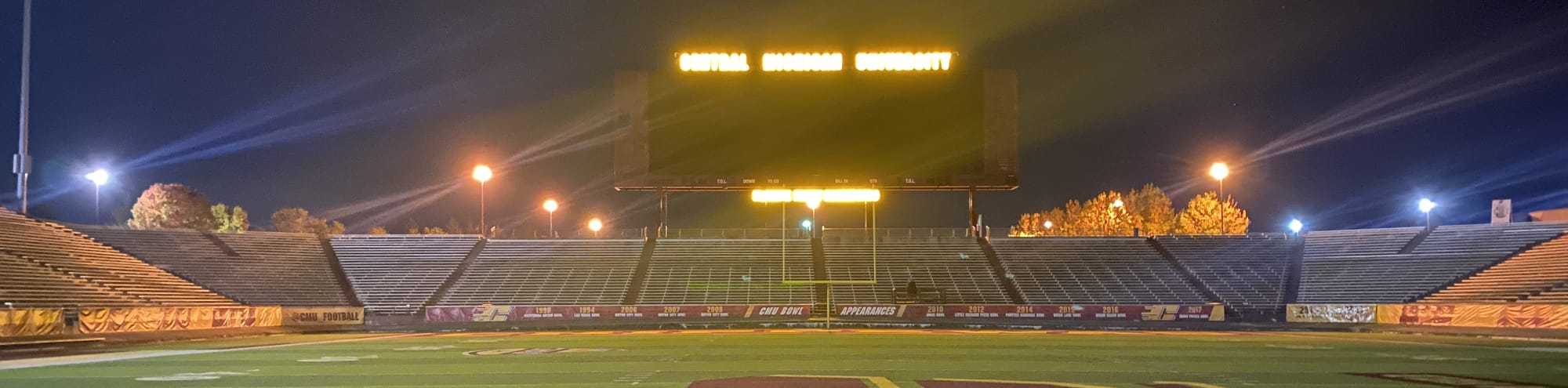 empty football stadium at night under the lights Champaign