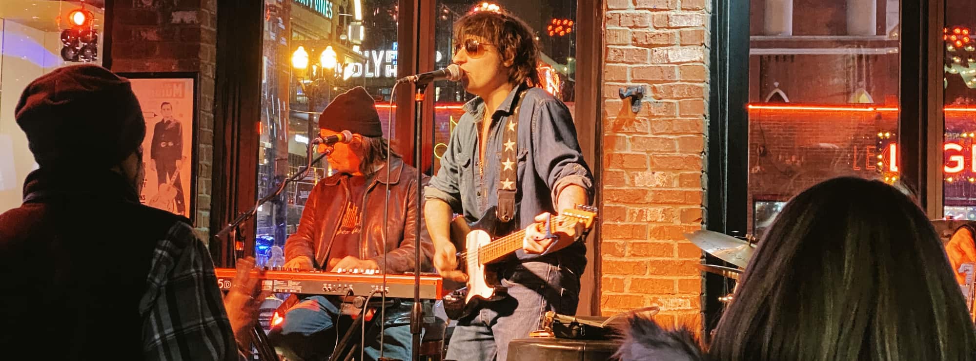 bar singer on guitar in Champaign