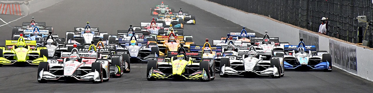 indy cars racing to through the start line Champaign